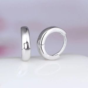 Sale 18kwg/Copper Huggies hoop earrings.